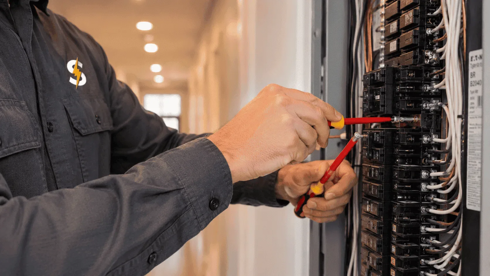 Electrician performing specialty electrical installation